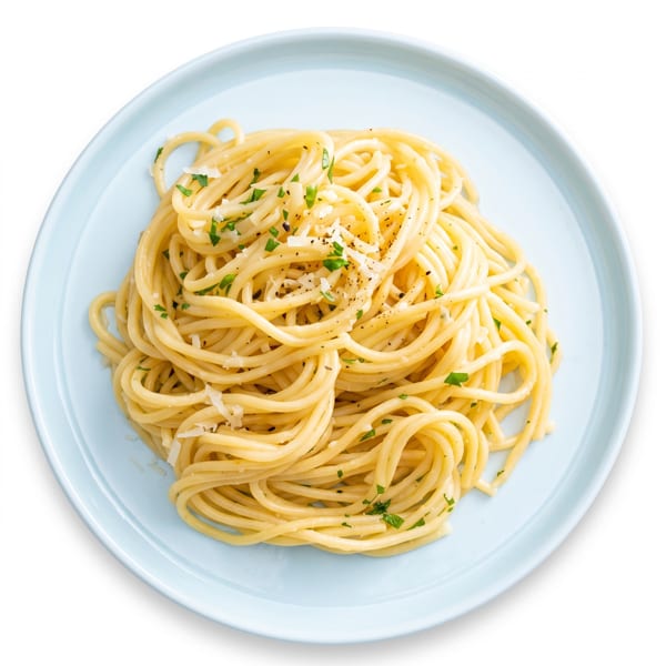 Plate of spaghetti topped with grated Parmesan, chopped parsley, and black pepper.